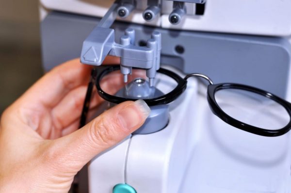 Lenses technician using state of the art equipment to secure new lenses